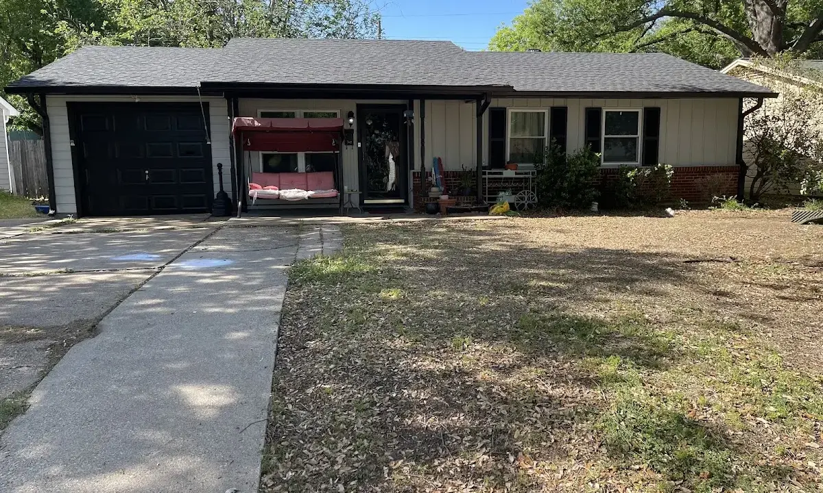 Soffit & Fascia Repair crew at work on a residential roof in Gulfport
